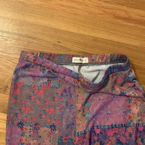 Super soft, fun multi-colored flare pants. Large but fits like a medium.